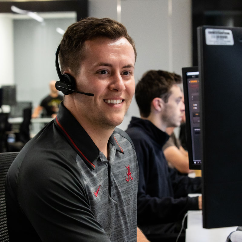 An Echo employee working at their desk answering phone calls from respective clients.