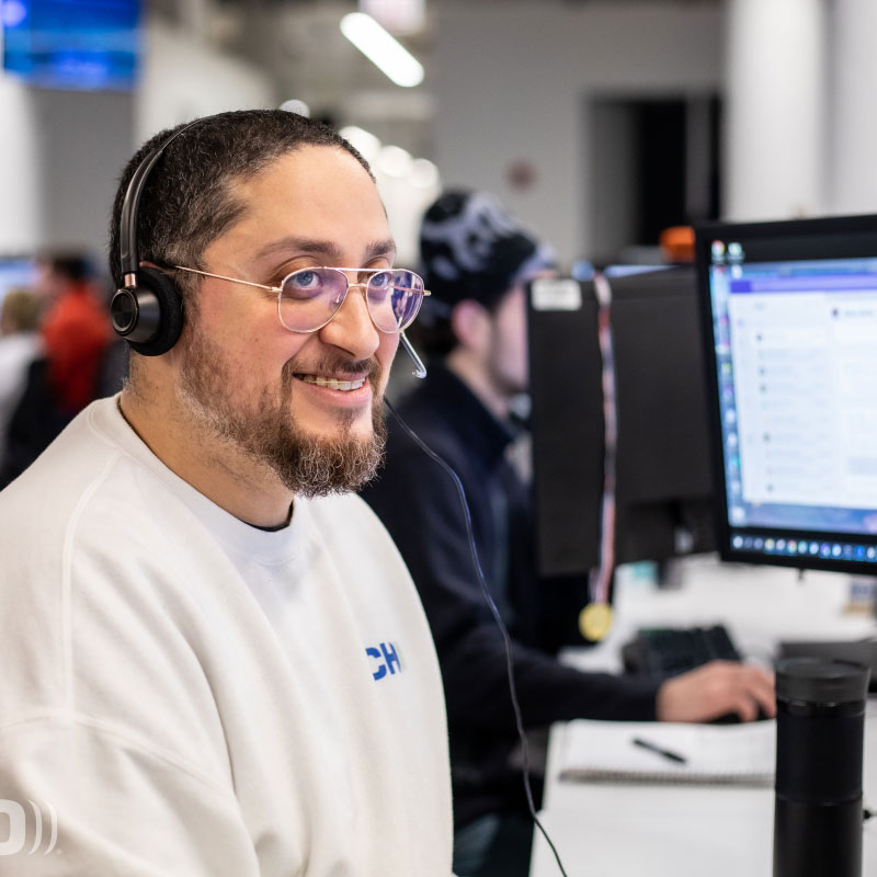 An Echo employee working at desk answering phone calls.