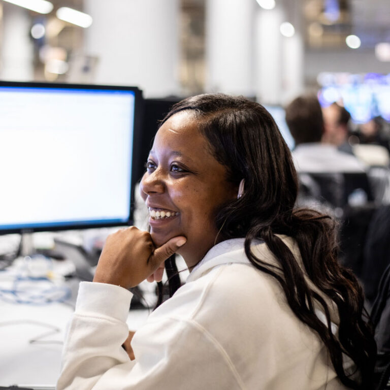 An Echo employee working on clients' intermodal shipping solutions at their computer.