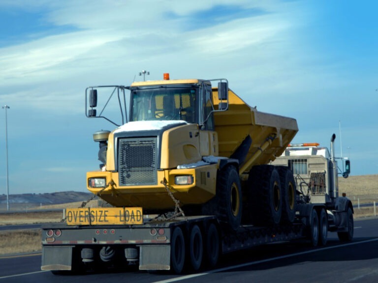 A heavy load being transported down the highway.