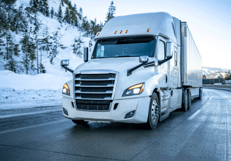 white semi truck on the highway in winter