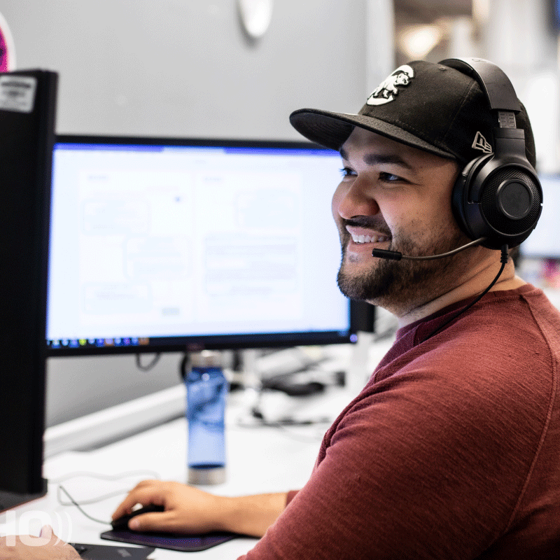 Echo male employee working at desktop.