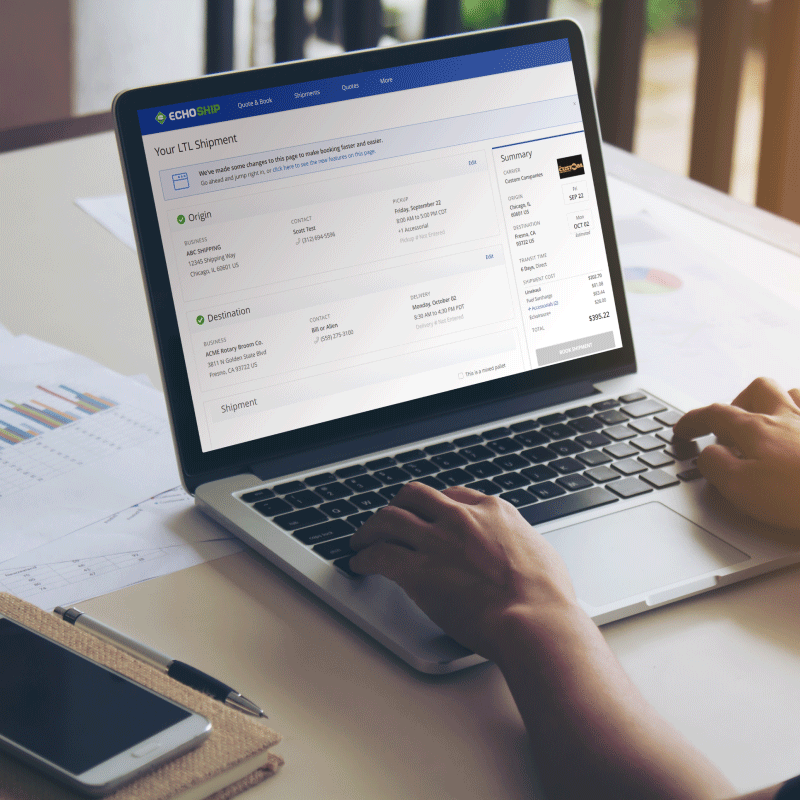 A shipper on a laptop utilizing EchoShip, Echo's web portal for self-service LTL and truckload shipping.